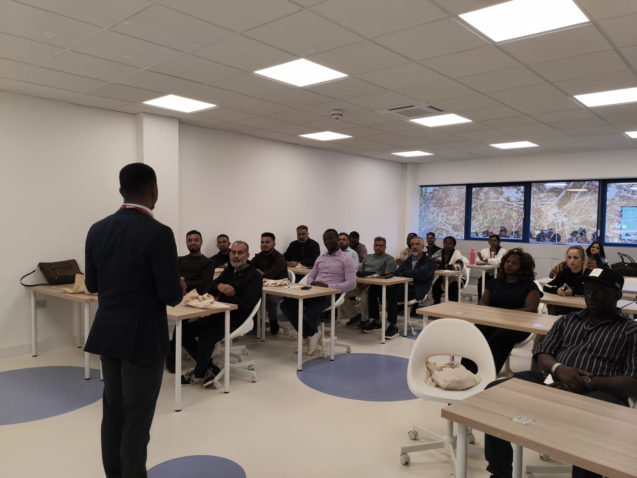 A lecturer teaching a class at Green Valley Academy